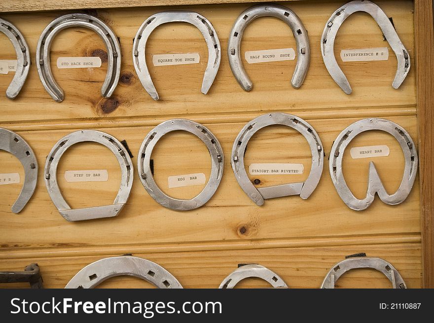 Close up of a display of various styles of horseshoes. Close up of a display of various styles of horseshoes