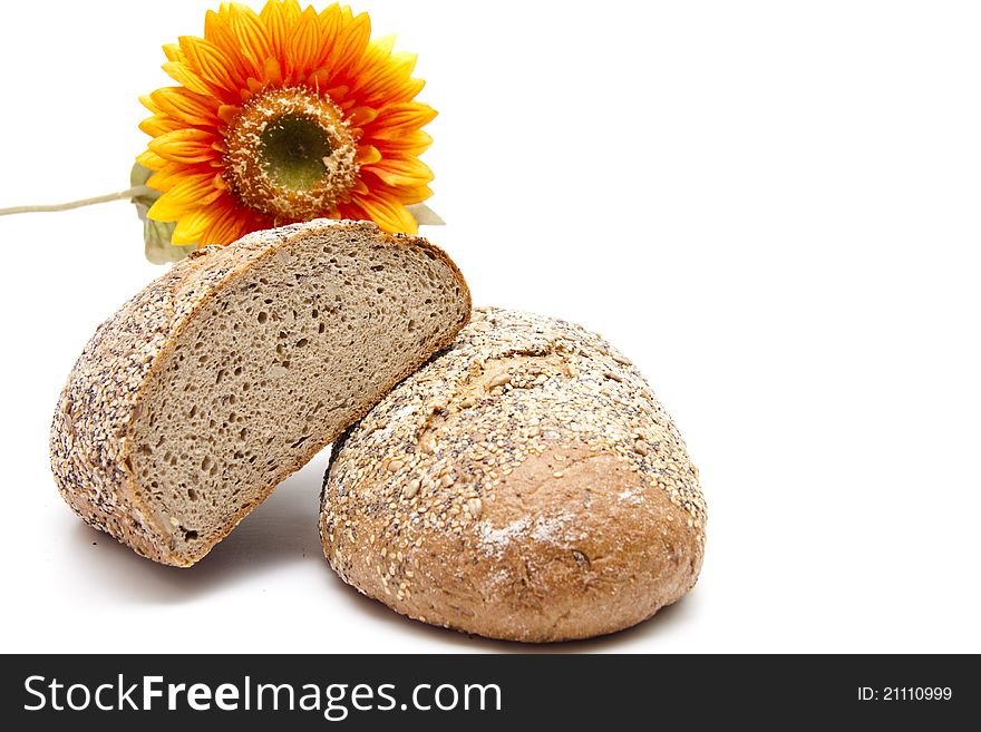More grain bread with sunflower on white background