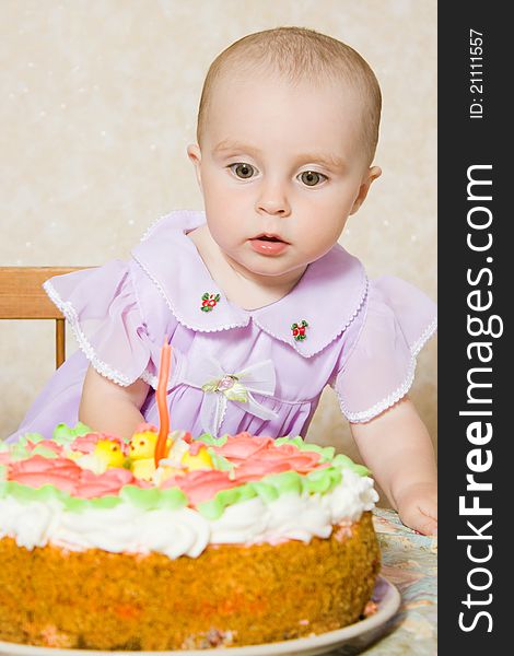 Baby with the birthday cake on a white background. Baby with the birthday cake on a white background.
