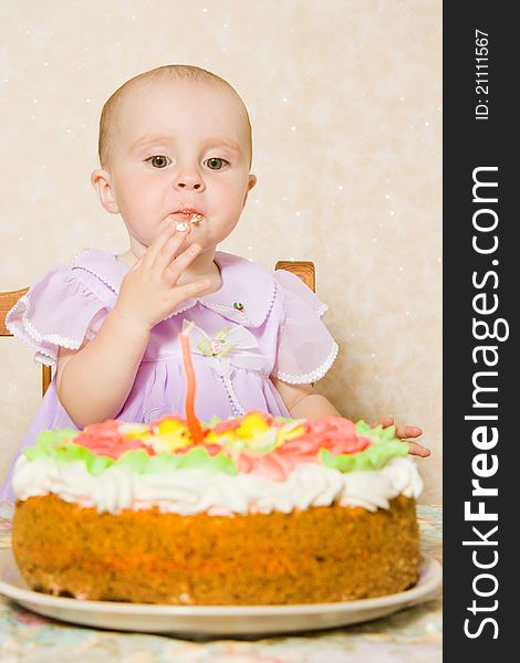 Baby with the birthday cake on a white background. Baby with the birthday cake on a white background.