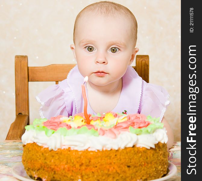 Baby with the birthday cake on a white background. Baby with the birthday cake on a white background.