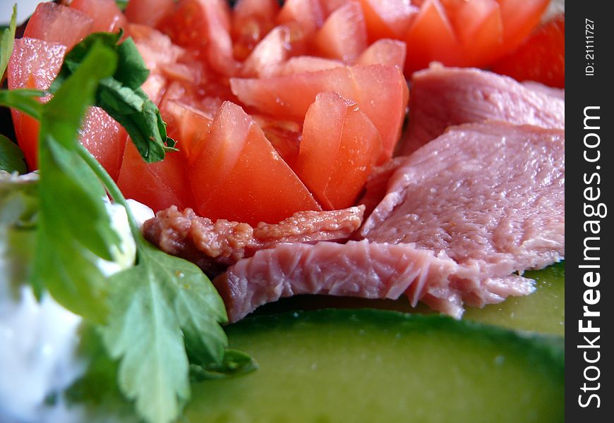 Fresh salad with tomatoes, cucumbers and ham