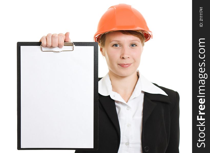 Businesswoman in a helmet shows the blank page.