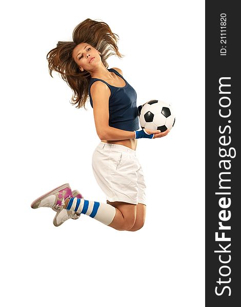 Girl jumpig with soccer ball