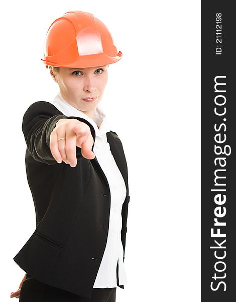 Businesswoman in a helmet shows the finger at the camera on a white background.