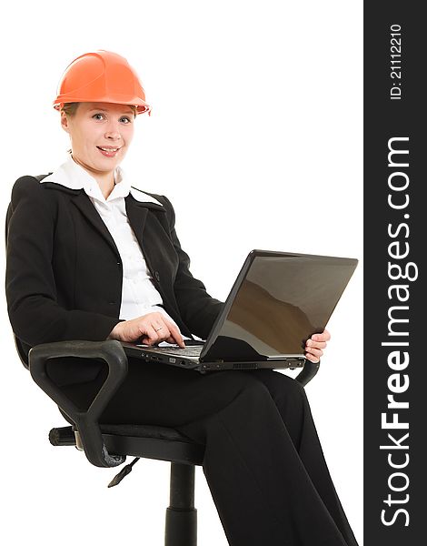 Businesswoman wearing a helmet with a laptop on a white background.