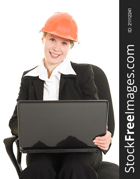 Happy businesswoman wearing a helmet with a laptop on a white background.