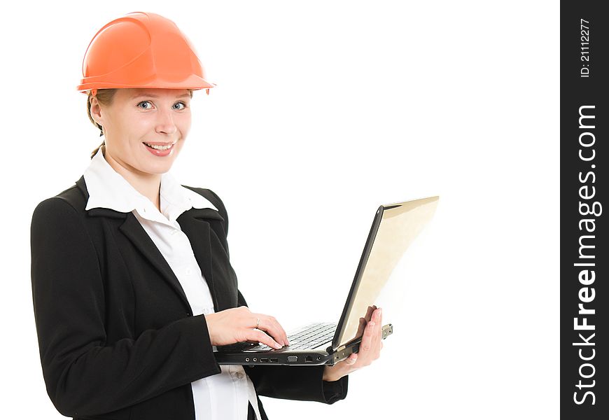 Happy businesswoman wearing a helmet with a laptop looking at camera on a white background.