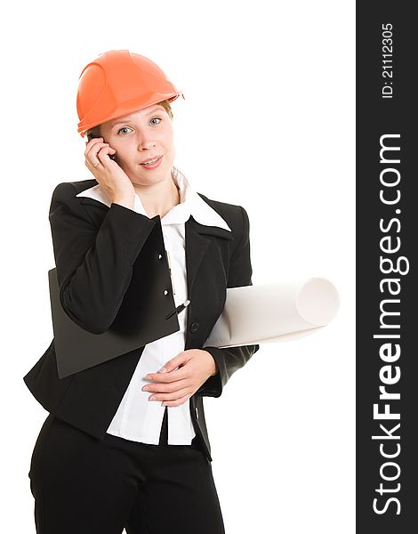Businesswoman in a helmet with a mobile phone