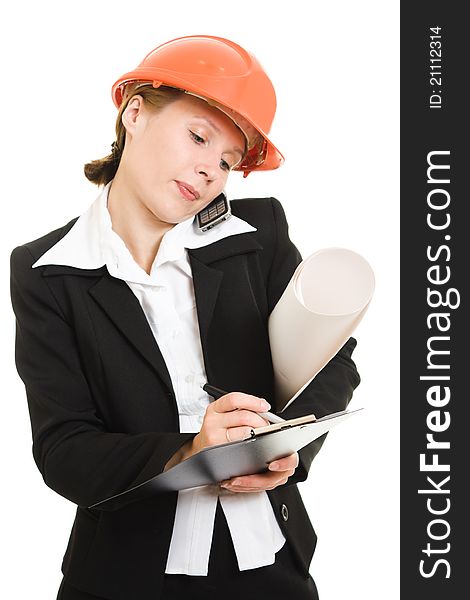 Businesswoman in a helmet with a mobile phone and drawings on a white background.