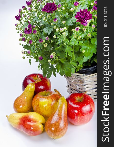 Basket with flowers and fresh fruits. Basket with flowers and fresh fruits