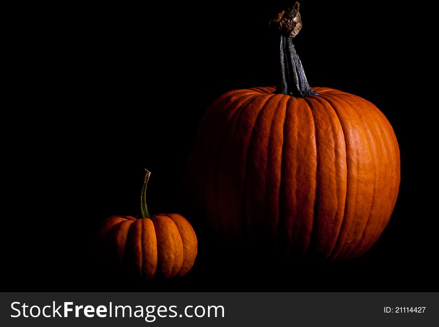 Ripe pumpkin fruits isolated on black