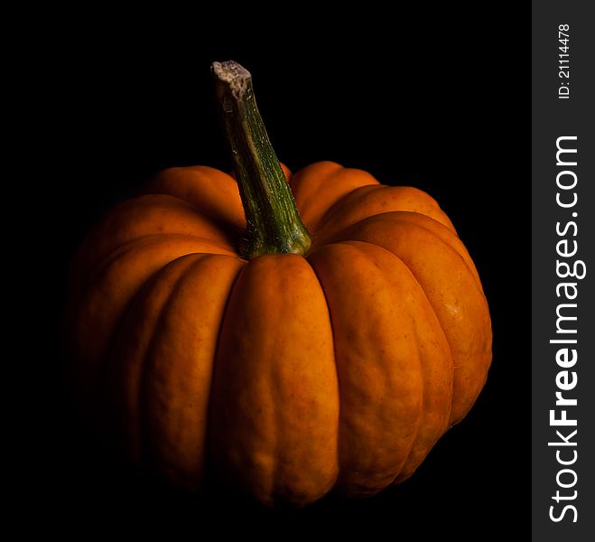 Ripe pumpkin fruits isolated on black