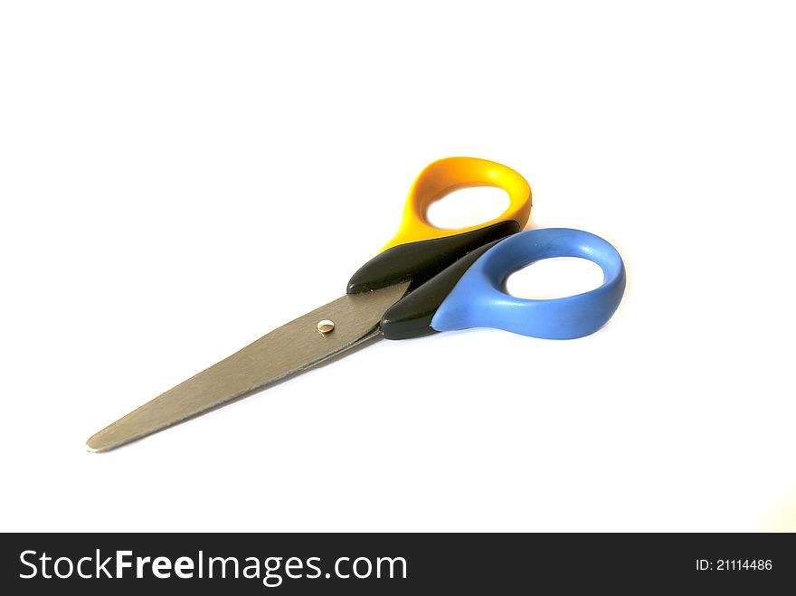 Metal scissors with plastic handle isolated on white background