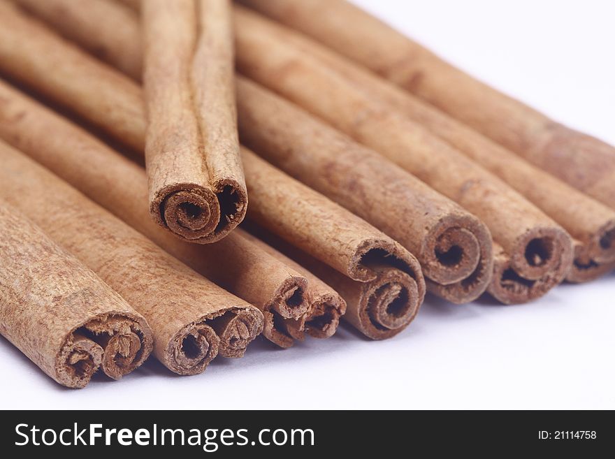 The cinnamon sticks on white background