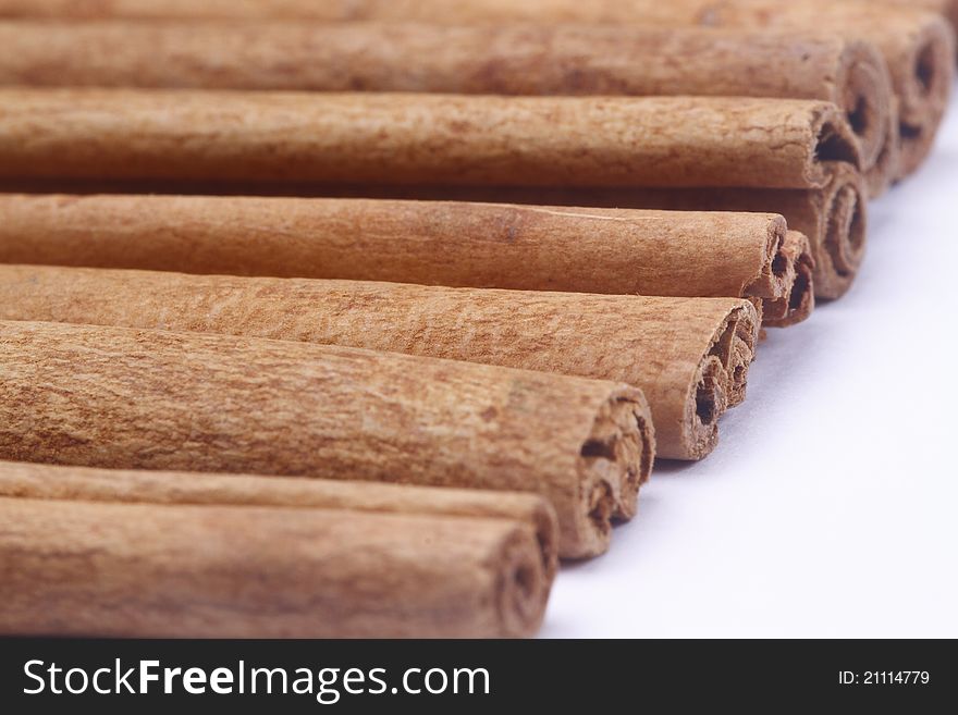 The cinnamon sticks on white background