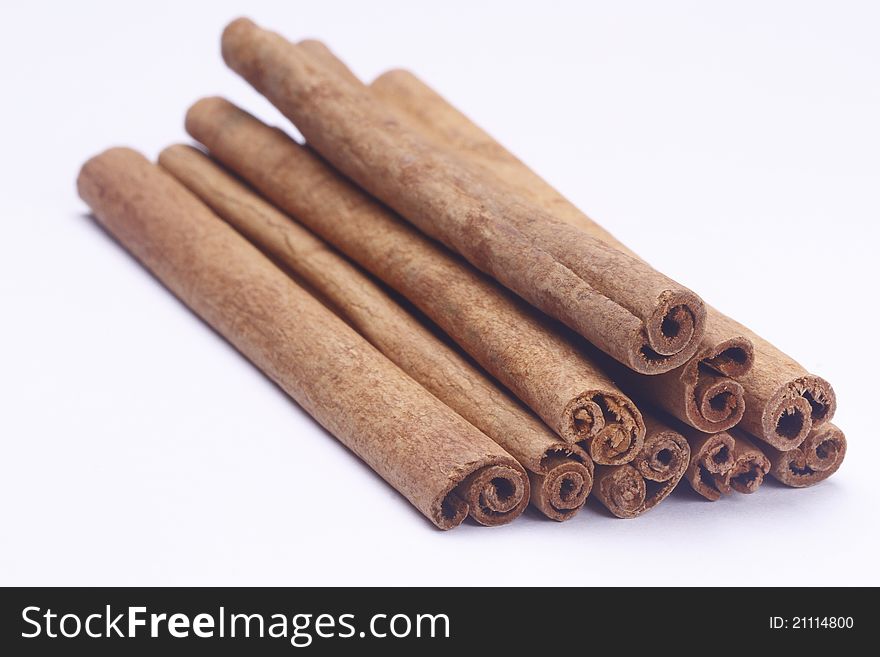 The cinnamon sticks on white background
