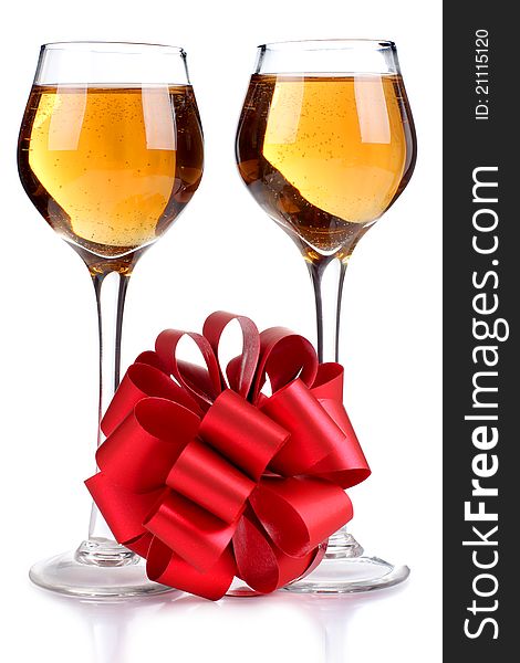 Color photo of wine glasses and a red ribbon. Color photo of wine glasses and a red ribbon