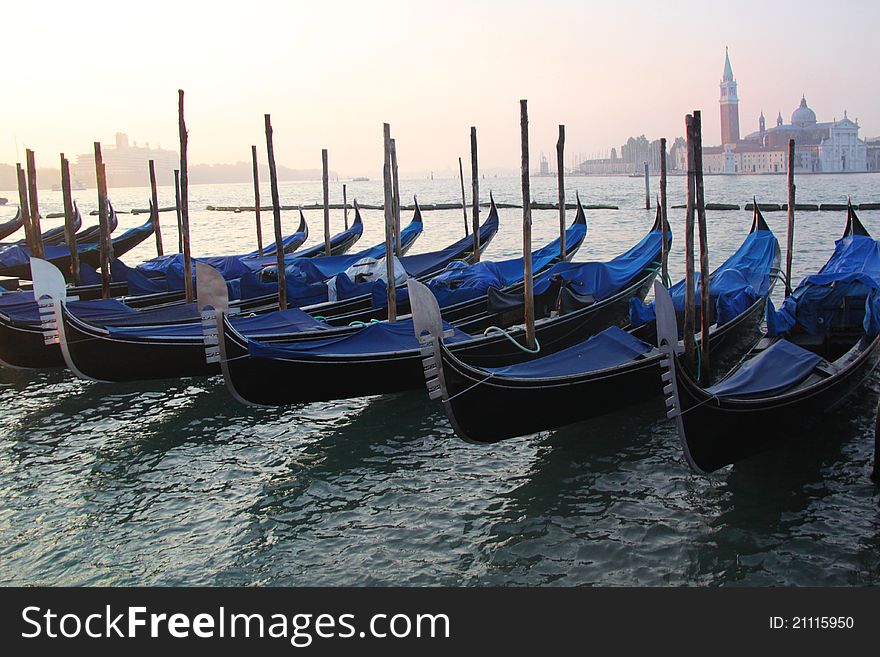 The gondola is a traditional, flat-bottomed Venetian rowing boat, well suited to the conditions of the Venetian Lagoon. For centuries gondolas were the chief means of transportation and most common watercraft within Venice. In modern times the iconic boats still have a role in public transport in the city, serving as traghetti (ferries) over the Grand Canal. Gondolas are hand made using 8 different types of wood (fir, oak, cherry, walnut, elm, mahogany, larch and lime) and are composed of 280 pieces. The gondola is a traditional, flat-bottomed Venetian rowing boat, well suited to the conditions of the Venetian Lagoon. For centuries gondolas were the chief means of transportation and most common watercraft within Venice. In modern times the iconic boats still have a role in public transport in the city, serving as traghetti (ferries) over the Grand Canal. Gondolas are hand made using 8 different types of wood (fir, oak, cherry, walnut, elm, mahogany, larch and lime) and are composed of 280 pieces