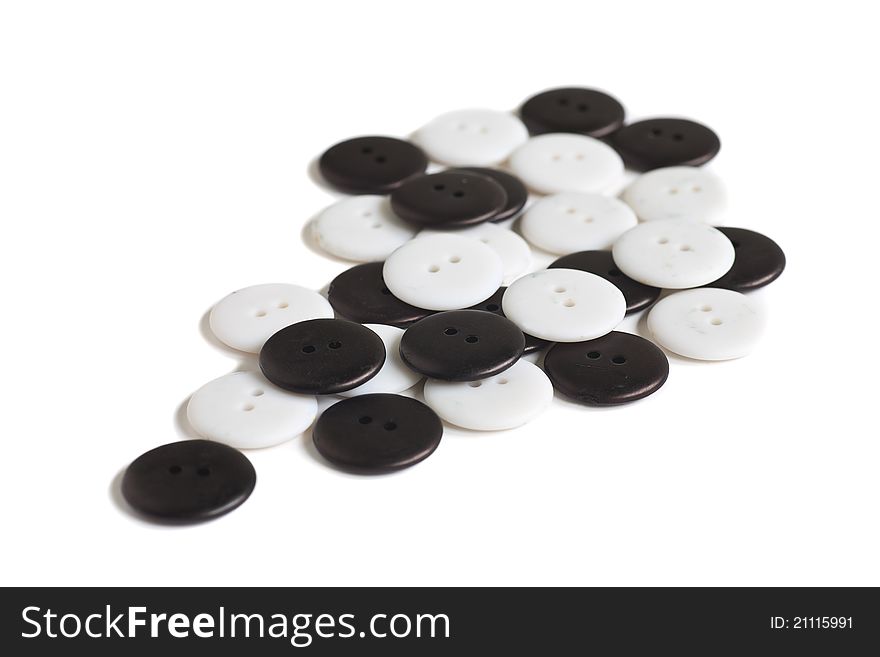 A collection of black and white buttons