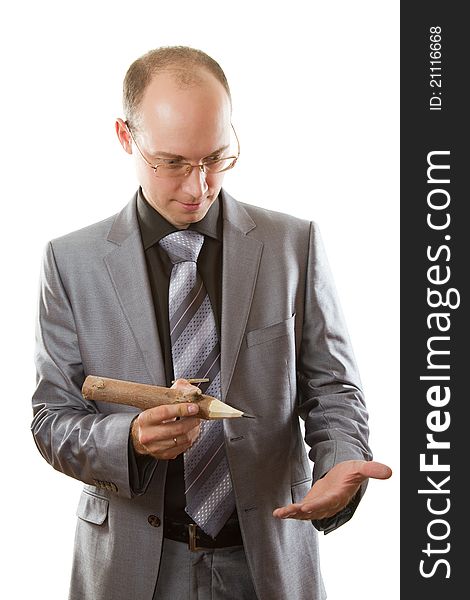 Businessman in a suit with a wooden pencil on a white background. Businessman in a suit with a wooden pencil on a white background