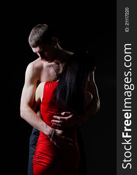 Studio portrait of embracing men and women. Studio portrait of embracing men and women