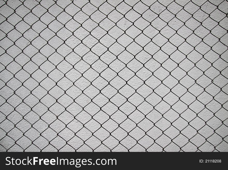 Iron Net And White Cement Wall