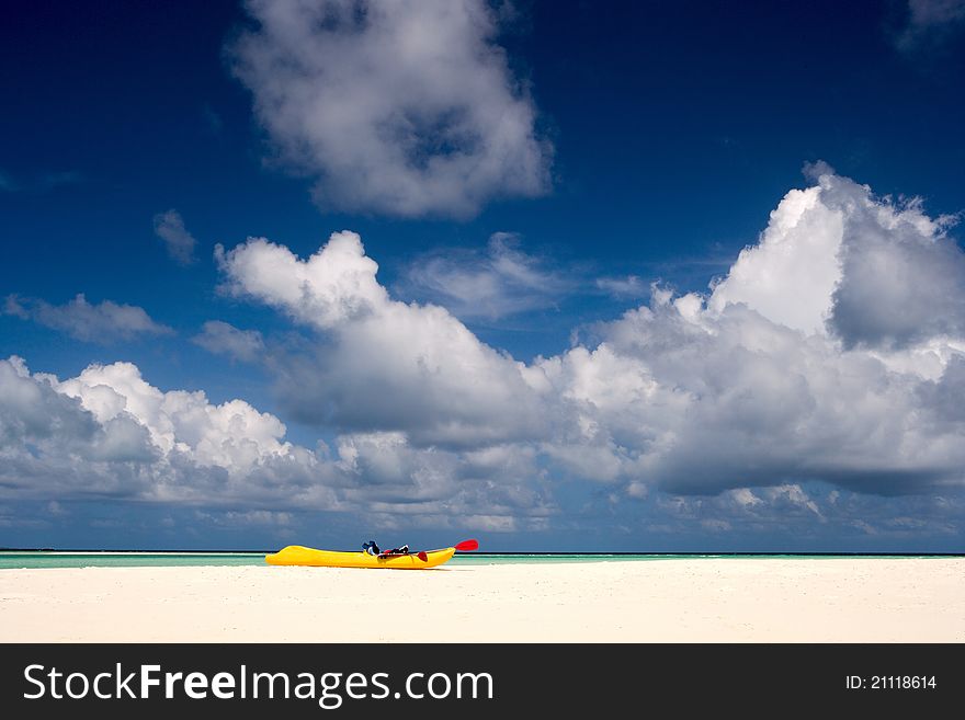 A boat on the sandy beach of  Maldives