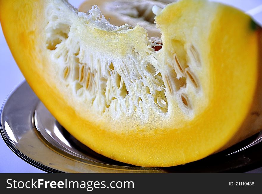 Slice Of Yellow Pumpkin On A Plate