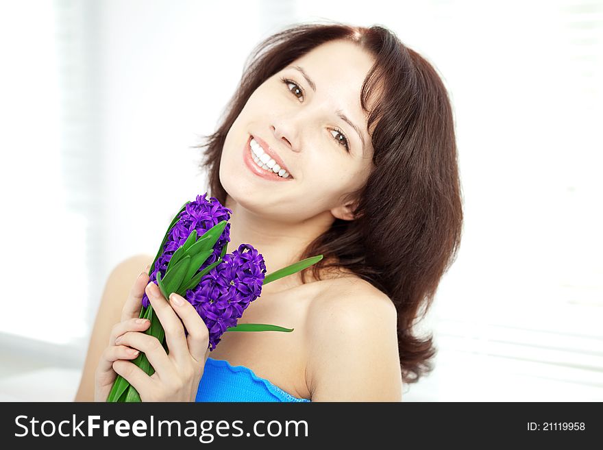 The image of a beautiful woman with holding flowers