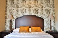 Bedroom Flowery Wall Paper And Wooden Furniture Stock Photography Bedroom Flowery Wall Paper And Wooden Furniture Stock Photography