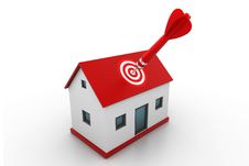 Red Dart On House Target Stock Photo
