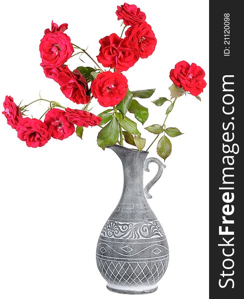 Red roses in a jar isolated on a white background. Red roses in a jar isolated on a white background