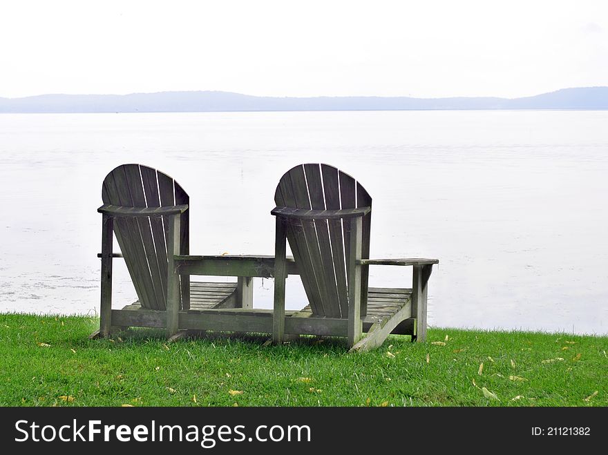 Adirondack Chairs Looking out over the Water. Adirondack Chairs Looking out over the Water