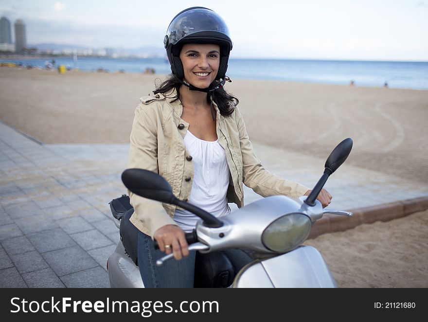 Attractive woman on a scooter