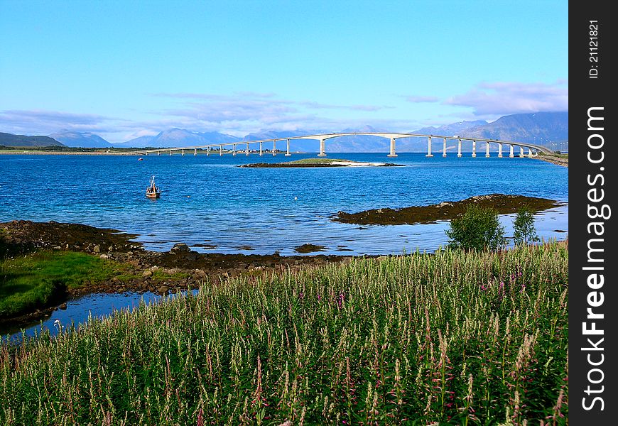 A bridge across a mountain lake in Norway. A bridge across a mountain lake in Norway