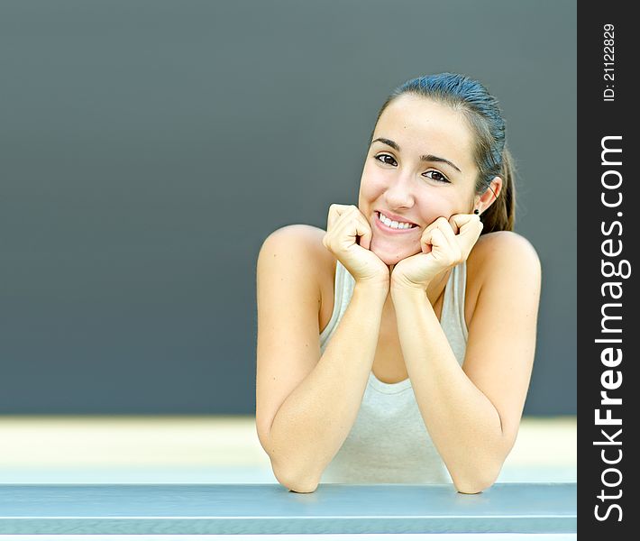 Girl Teen Resting Head In Hands Smiling