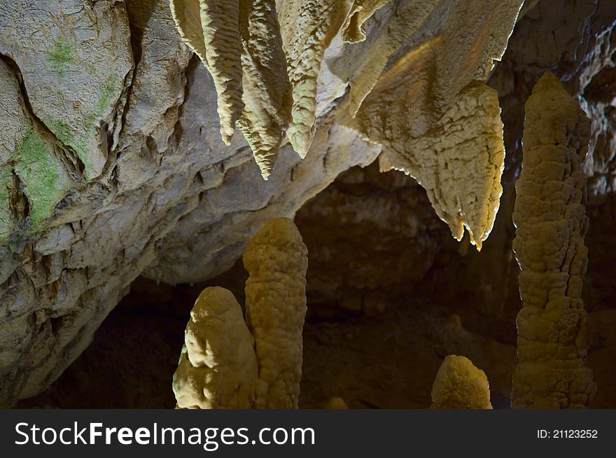 Unusual stalagmites in the underground cavern in france, vertical. Unusual stalagmites in the underground cavern in france, vertical