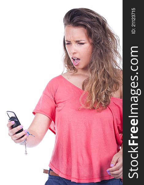 Angry young woman yelling at her phone