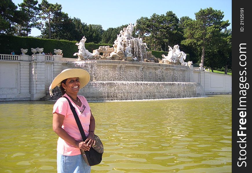 Happy Lady in front of the fountain in Vienna. Happy Lady in front of the fountain in Vienna