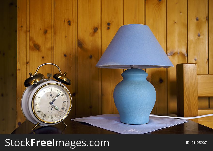 Swiss house decoration with old school clock and lamp. Swiss house decoration with old school clock and lamp