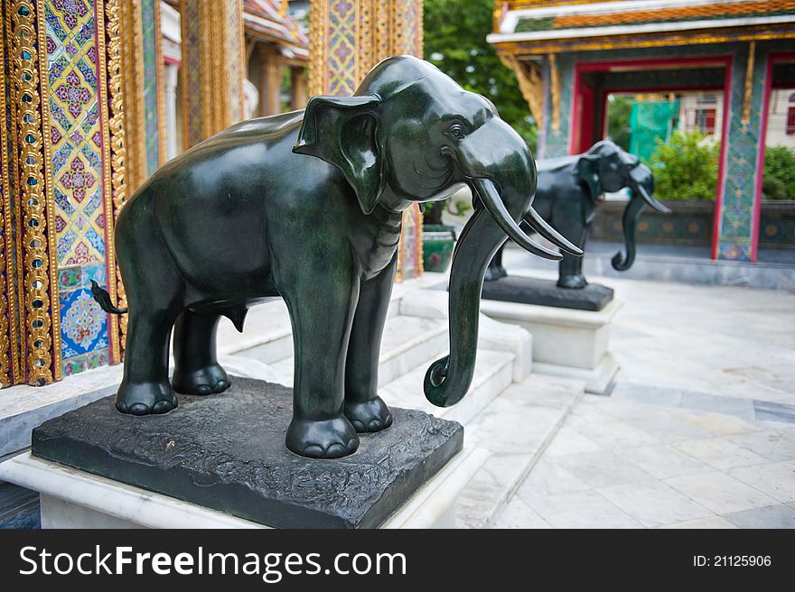 Two elephant statues near the entrance to a Thai temple in Asia