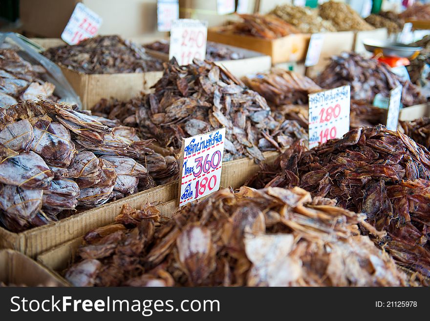 Rows of different kinds of dried seafood for sale at a Thai food market. Rows of different kinds of dried seafood for sale at a Thai food market