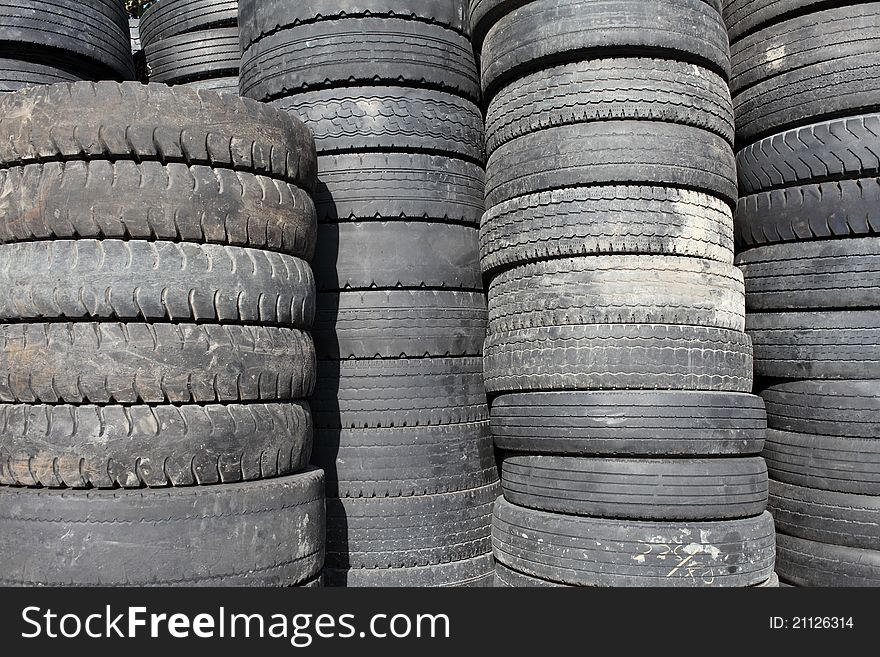 Pile of old car tires for rubber recycling. Pile of old car tires for rubber recycling