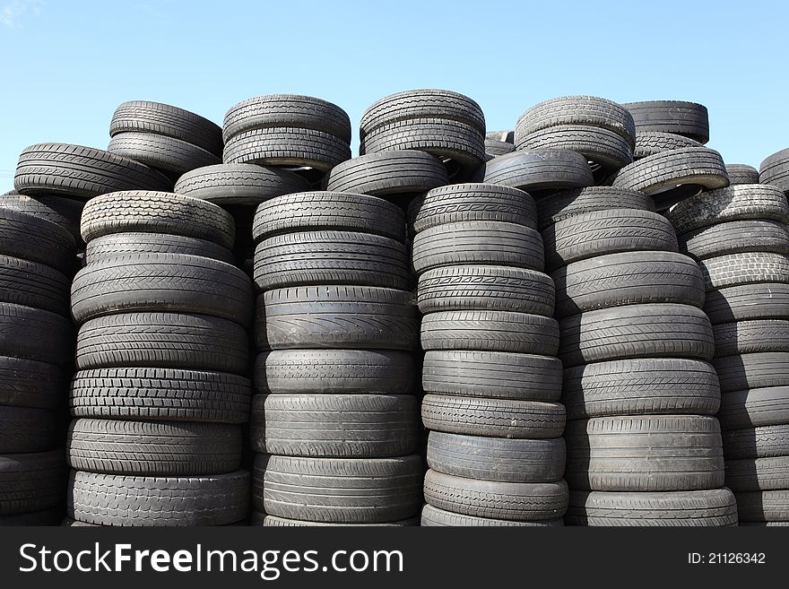 Old car tyres and blue sky