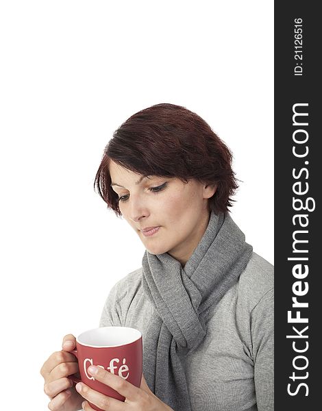 Thoughtful young woman holding a coffee cup. Thoughtful young woman holding a coffee cup