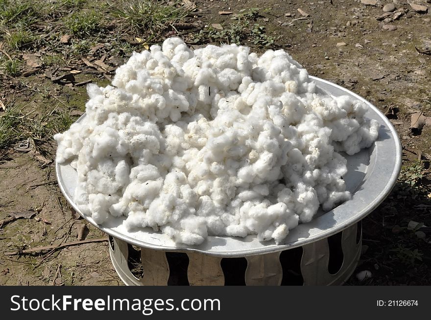 The pile of raw cotton together. In the agricultural sector. The pile of raw cotton together. In the agricultural sector.