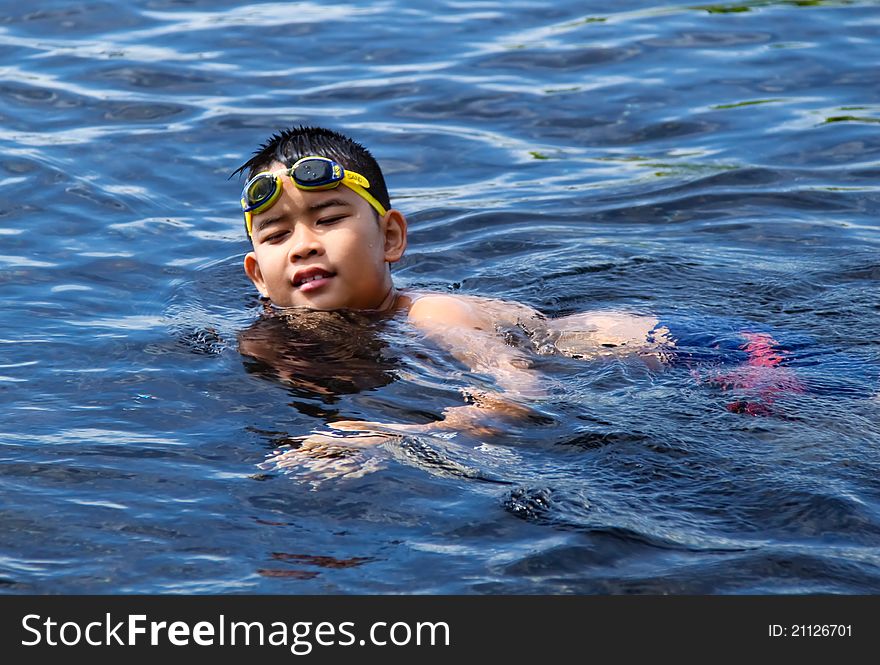 Asian boy swimming