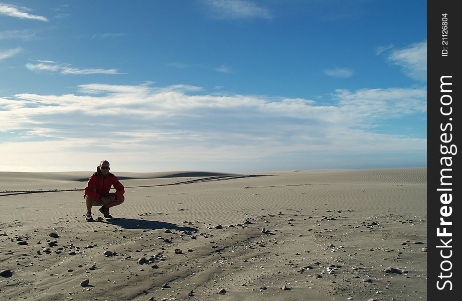 Tramper on the beach, Farewell Spit, South island, New Zealand