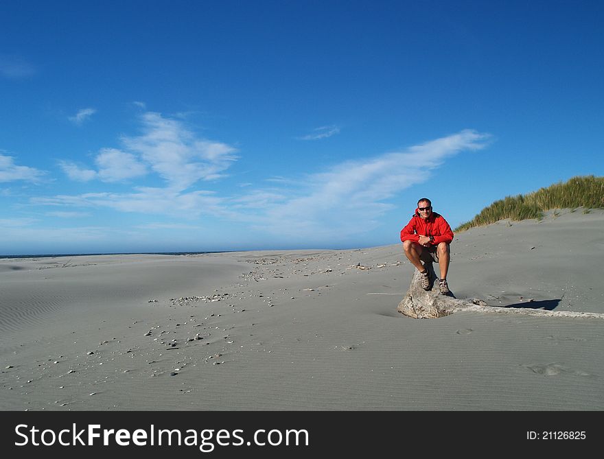Tramper on the beach, Farewell Spit, South island, New Zealand